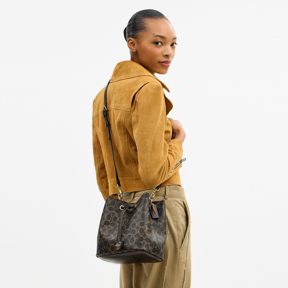 Coach Outlet Rowan Bucket Bag In Loved Signature Canvas With Charms